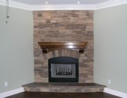 stacked stone fireplace by Acorn Construction - Thumb Pic 24
