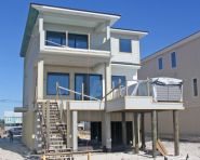 Davis modern coastal piling home on Navarre Beach by Acorn Fine Homes - Thumb Pic 8
