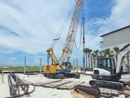 Modern coastal piling home on Navarre Beach by Acorn Fine Homes