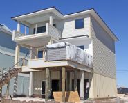 Davis modern coastal piling home on Navarre Beach by Acorn Fine Homes - Thumb Pic 9