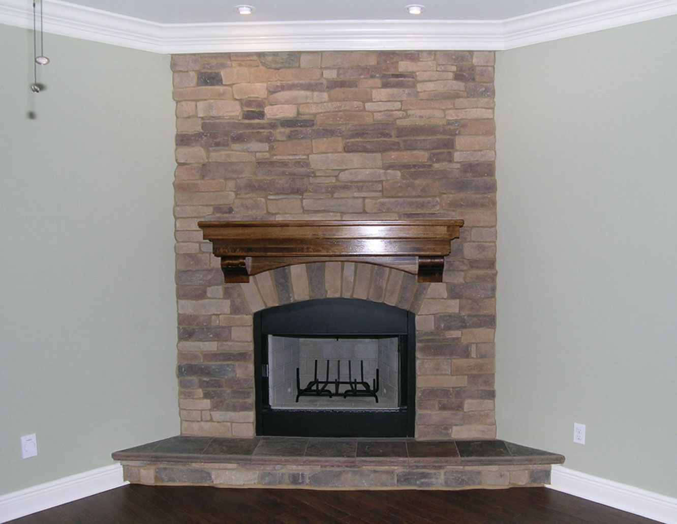 stacked stone fireplace by Acorn Construction