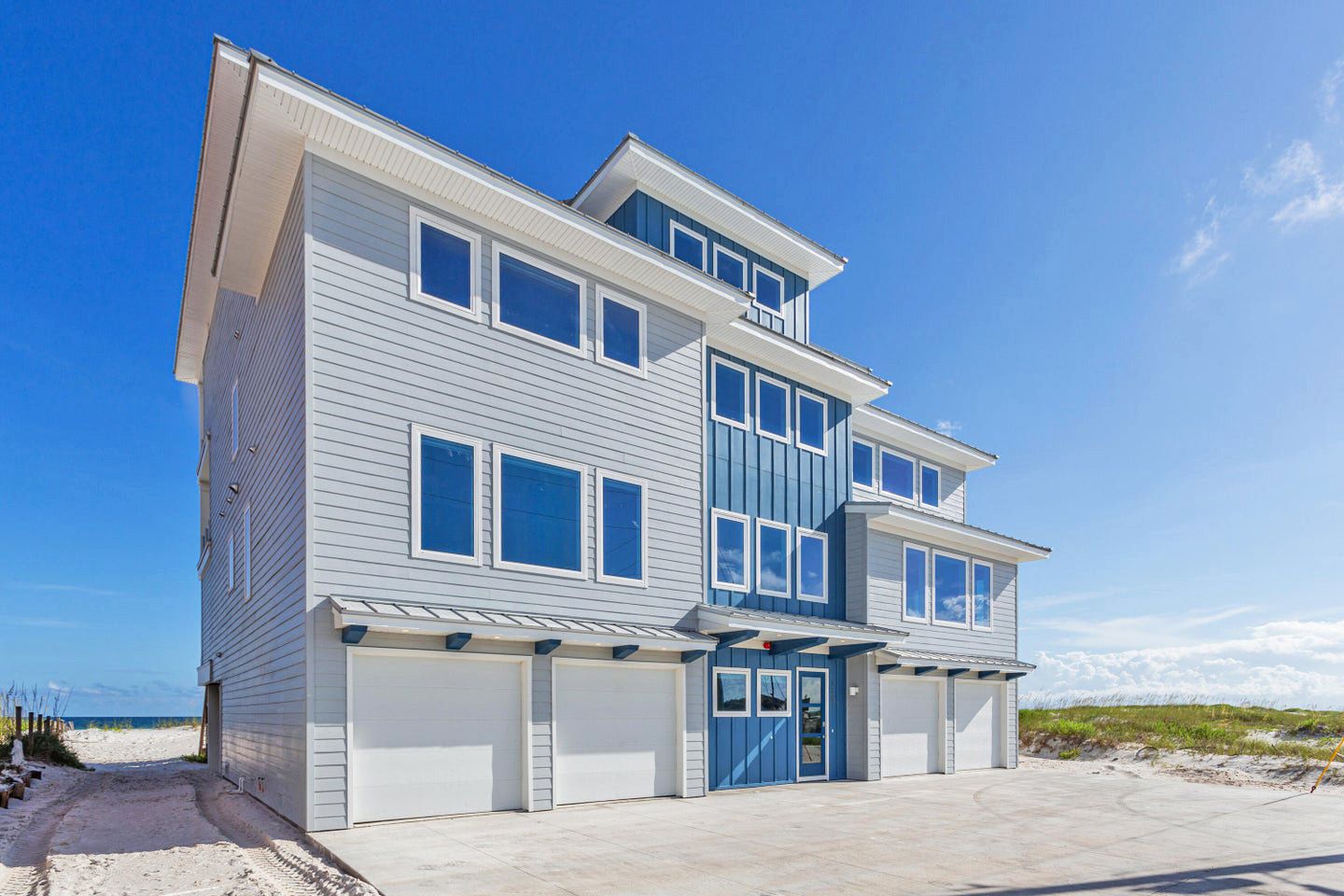 Modern coastal piling home in Navarre by Acorn Fine Homes