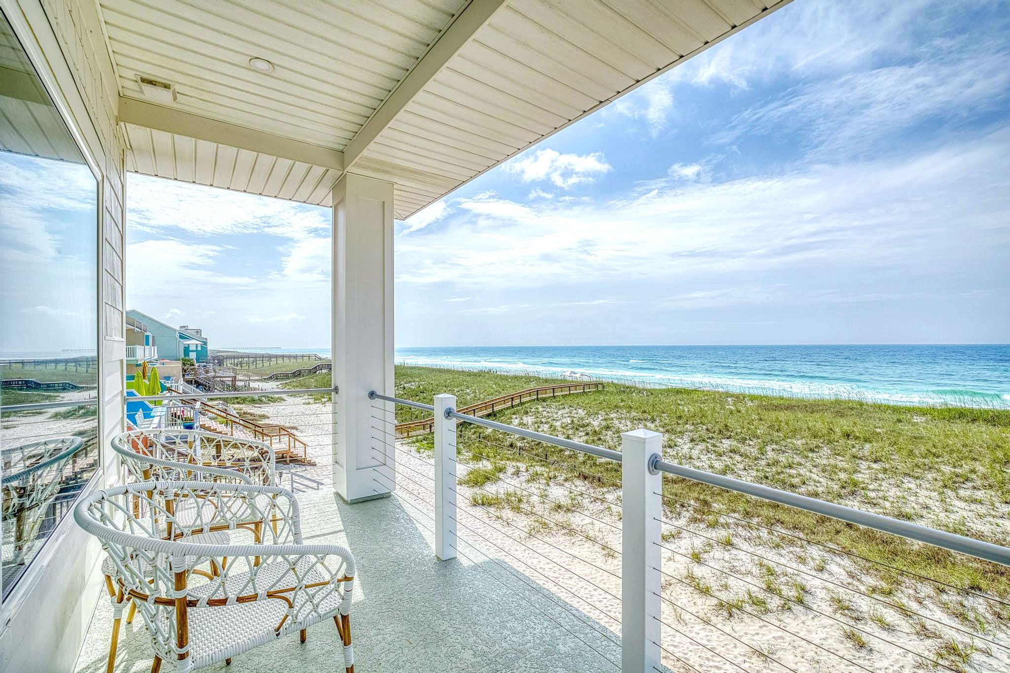 Modern coastal piling home in Navarre by Acorn Fine Homes