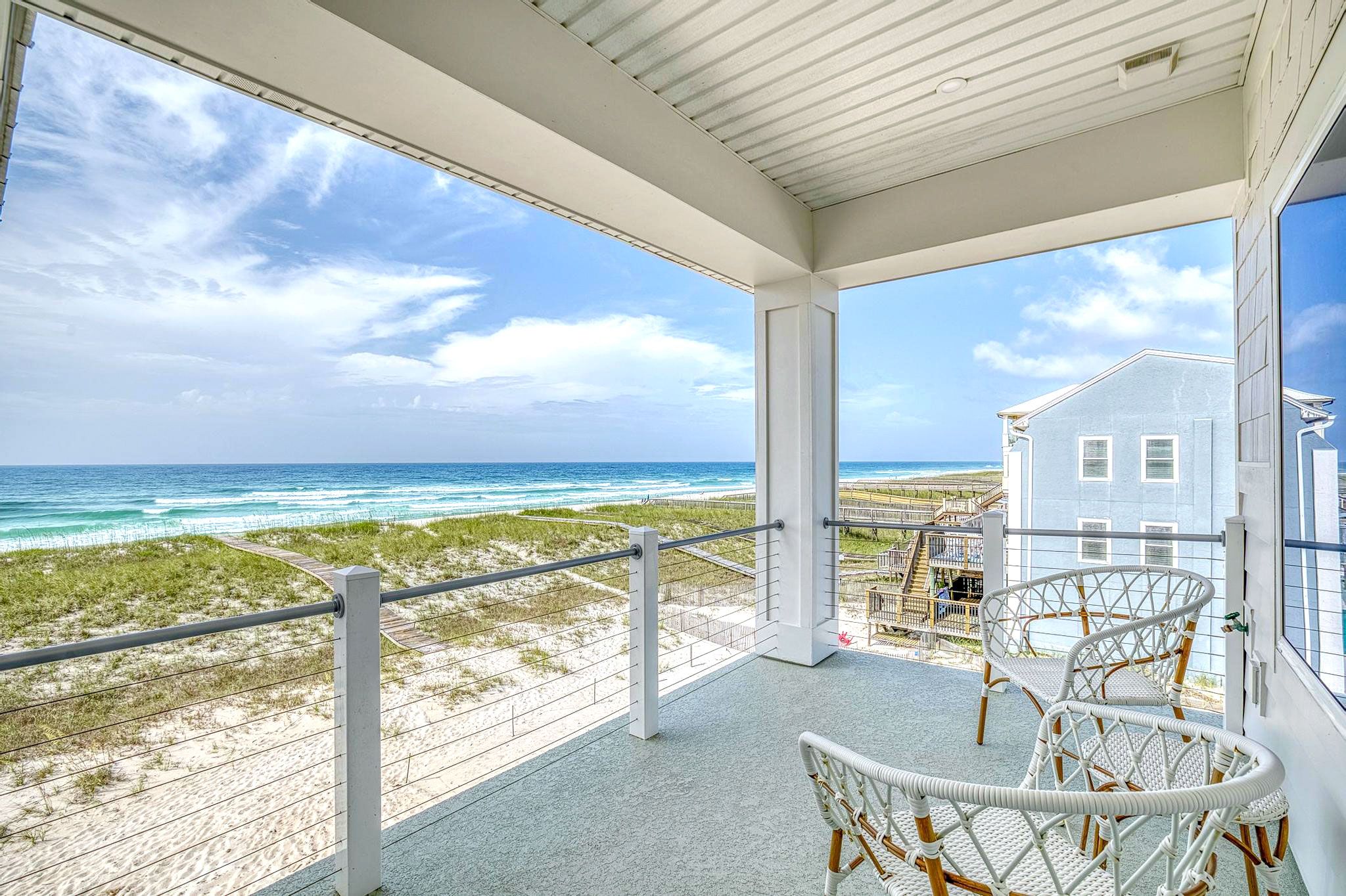 Modern coastal piling home in Navarre by Acorn Fine Homes