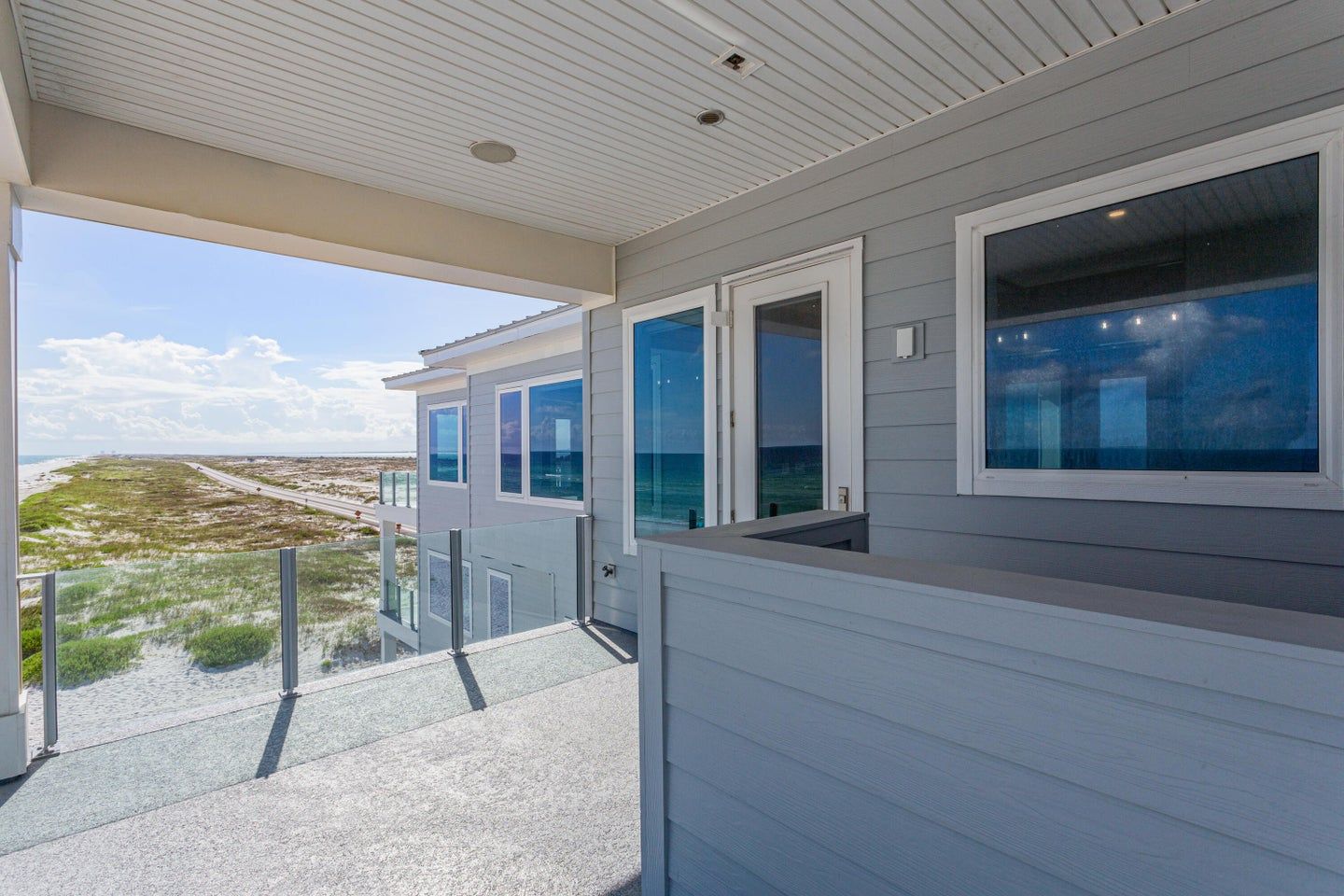 Modern coastal piling home in Navarre by Acorn Fine Homes