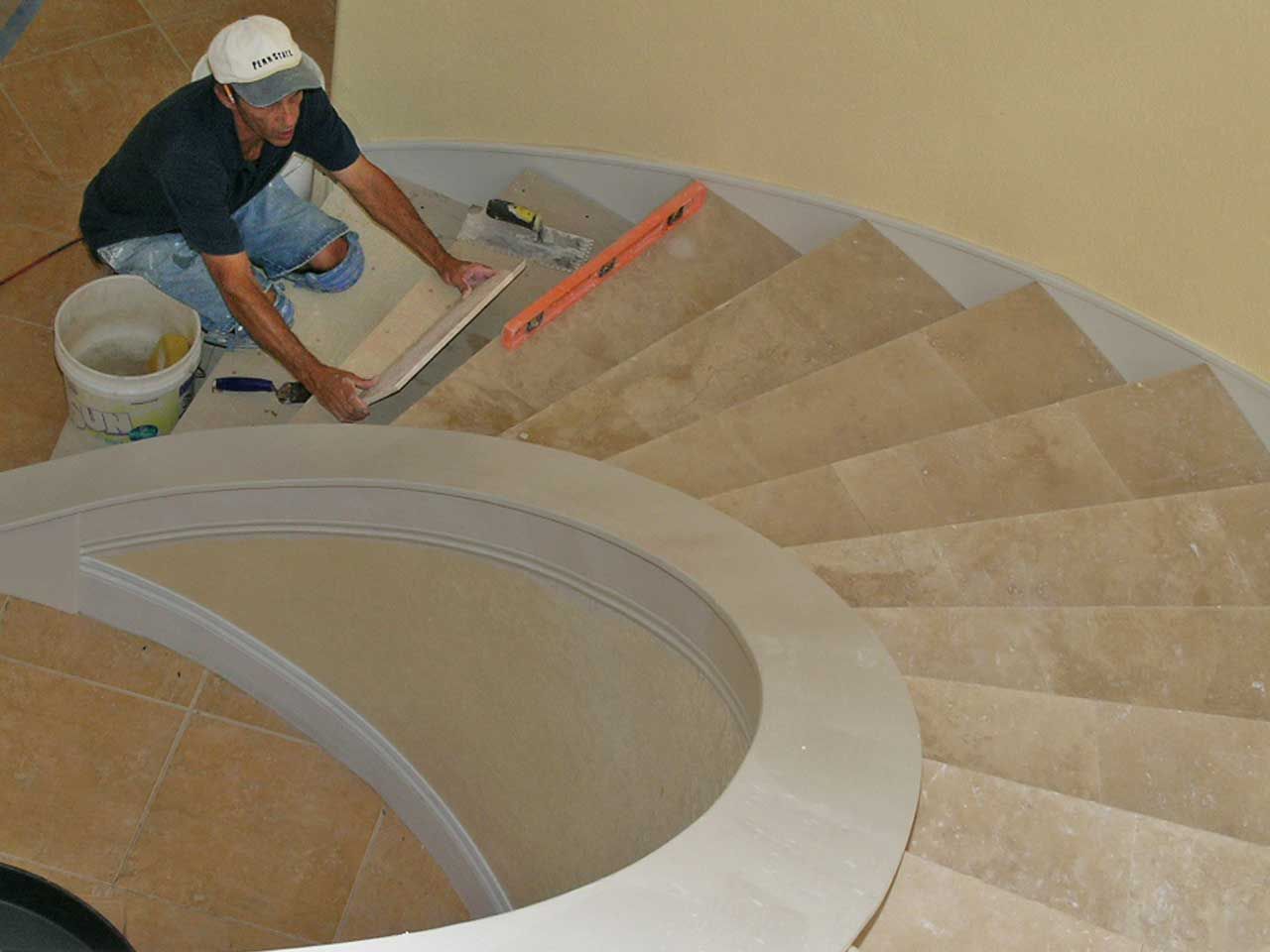 tile curved stair case by Acorn Construction