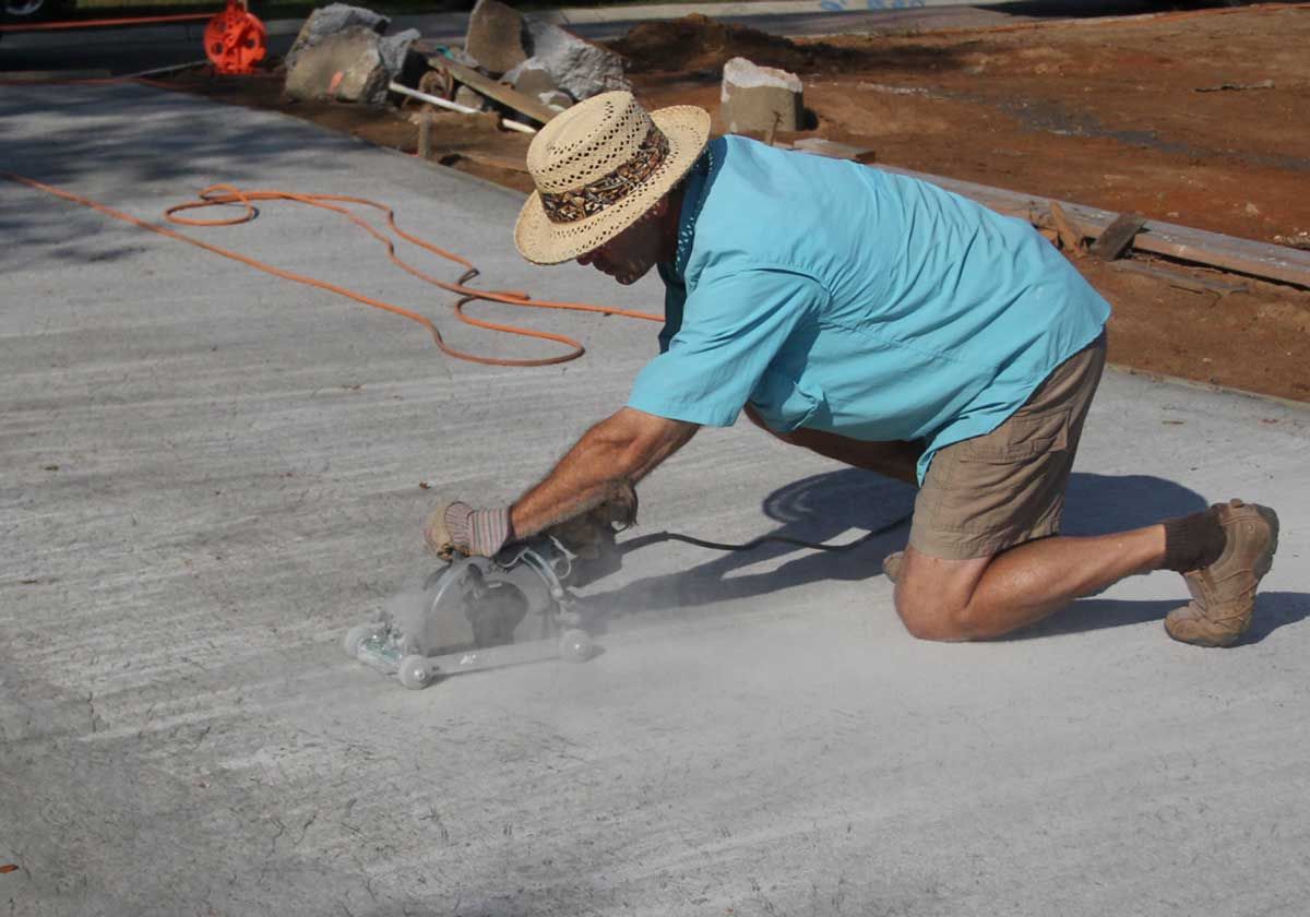 Cutting concrete control joints in the Spear driveway