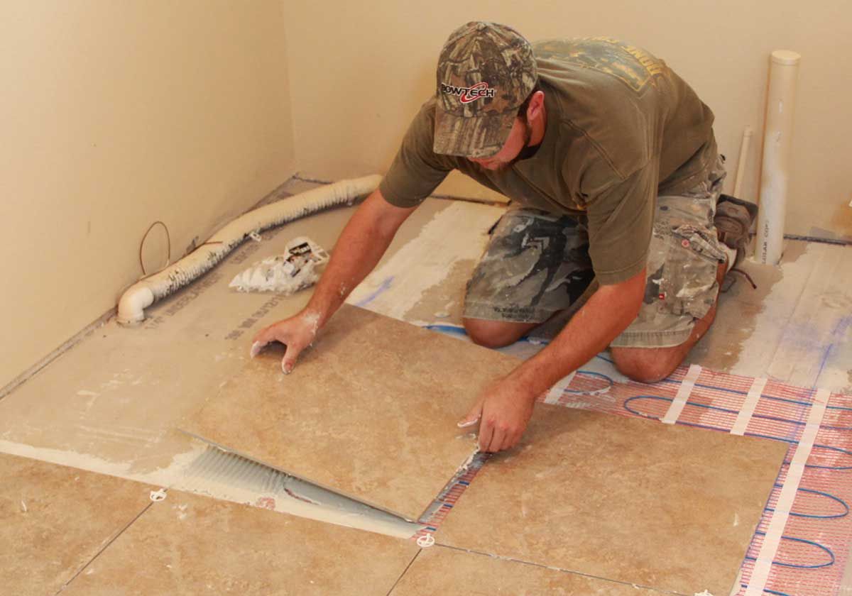 Laying tile over a radiant floor heating grid by Acorn Fine Homes